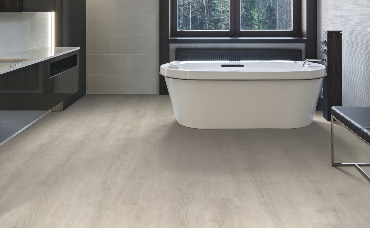 Laminate flooring in a bathroom with soaking tub