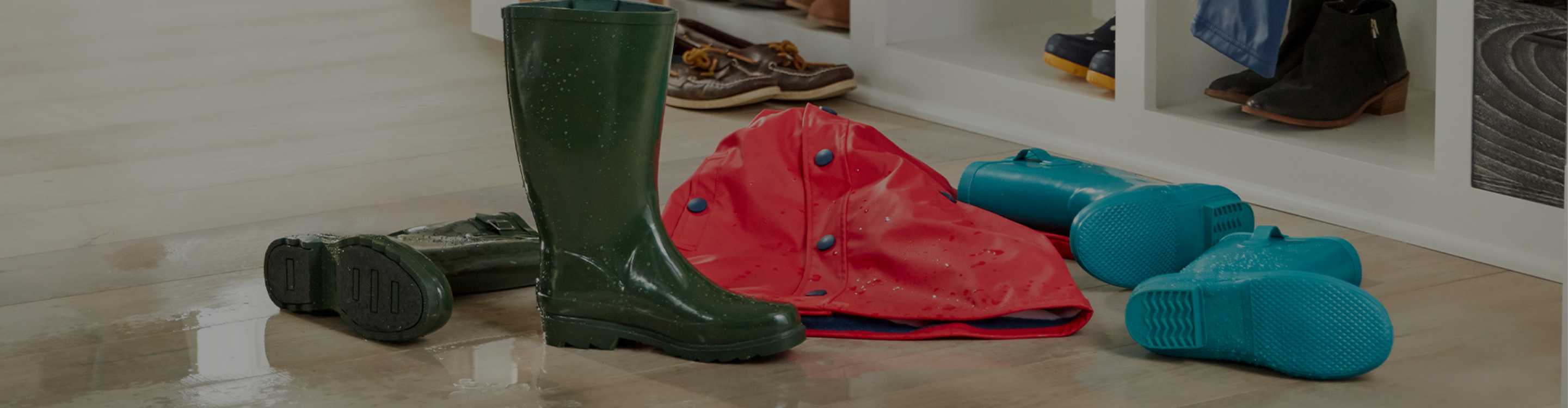 Waterproof Flooring with rainboots, rain jacket, and puddle